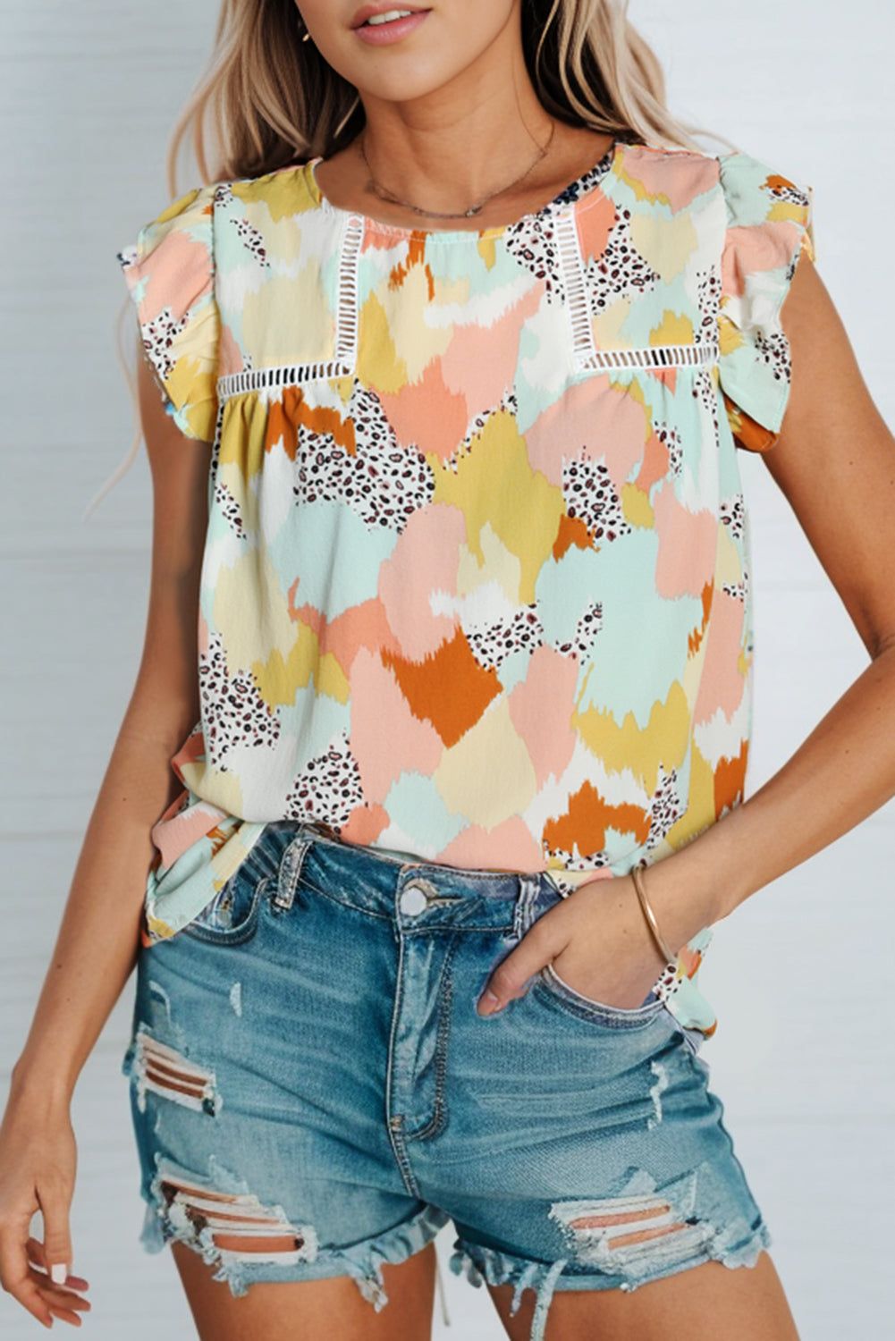 Printed Round Neck Flutter Sleeve Top.