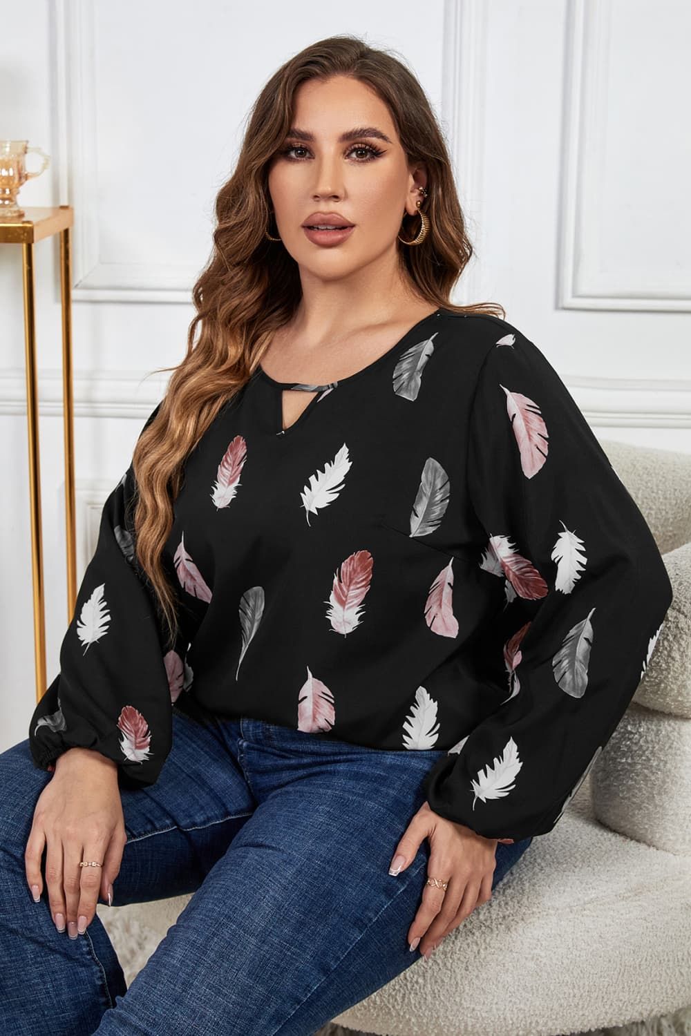 Melo Apparel Plus Size Printed Round Neck Long Sleeve Cutout Blouse.