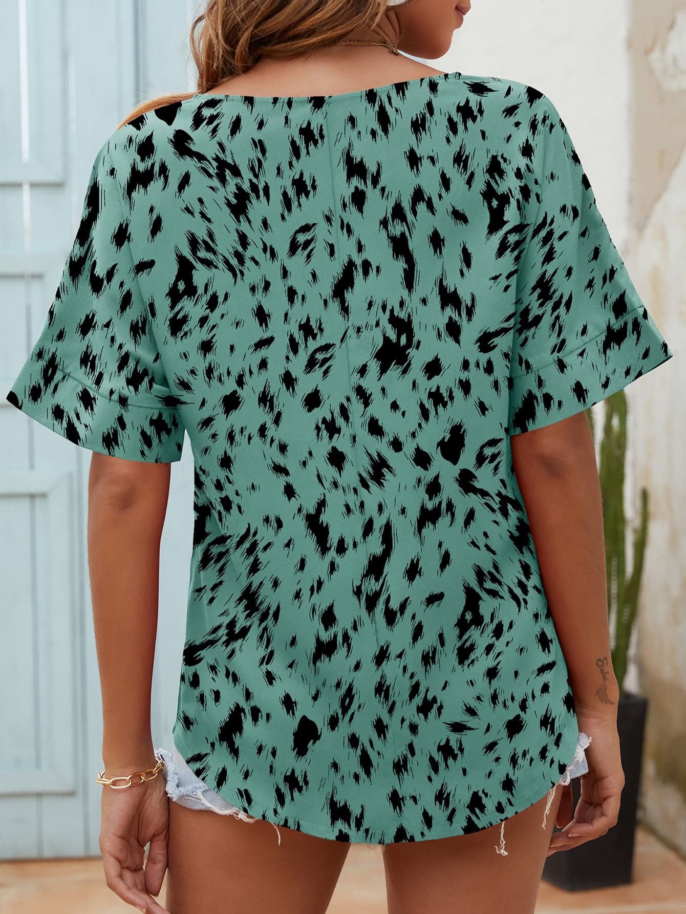 Printed Notched Neck Half Sleeve Blouse.