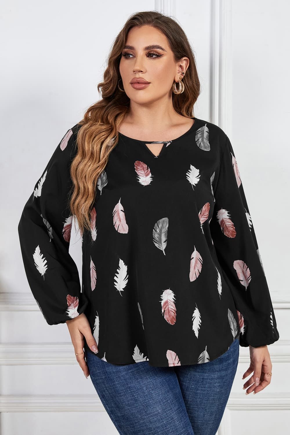 Melo Apparel Plus Size Printed Round Neck Long Sleeve Cutout Blouse.