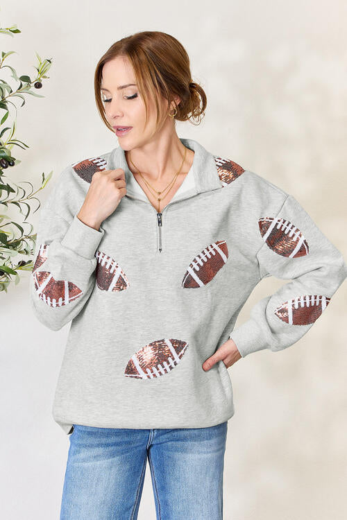 Double Take Full Size Sequin Football Half Zip Long Sleeve Sweatshirt - By Baano